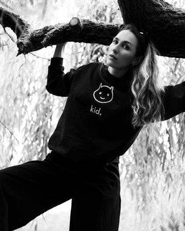 Female Wearing Classic kid. Med Logo Sweatshirt Outdoors